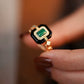 Close-up of Malachite 18K Gold Ring with vibrant green gemstone in Art Deco-inspired design.