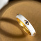 White Enamel Ring with Blue Sapphires