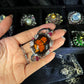 Hand-Carved Natural Baltic Amber Cameo Necklace with Rubies and White Sapphires