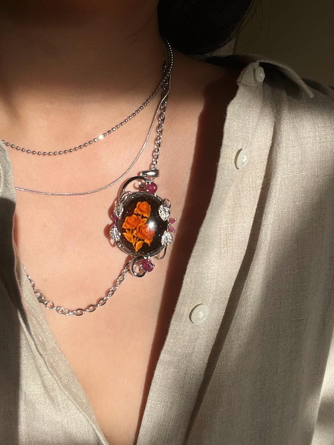 Hand-Carved Natural Baltic Amber Cameo Necklace with Rubies and White Sapphires