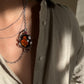 Hand-Carved Natural Baltic Amber Cameo Necklace with Rubies and White Sapphires