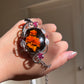 Hand-Carved Natural Baltic Amber Cameo Necklace with Rubies and White Sapphires
