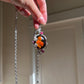 Hand-Carved Natural Baltic Amber Cameo Necklace with Rubies and White Sapphires